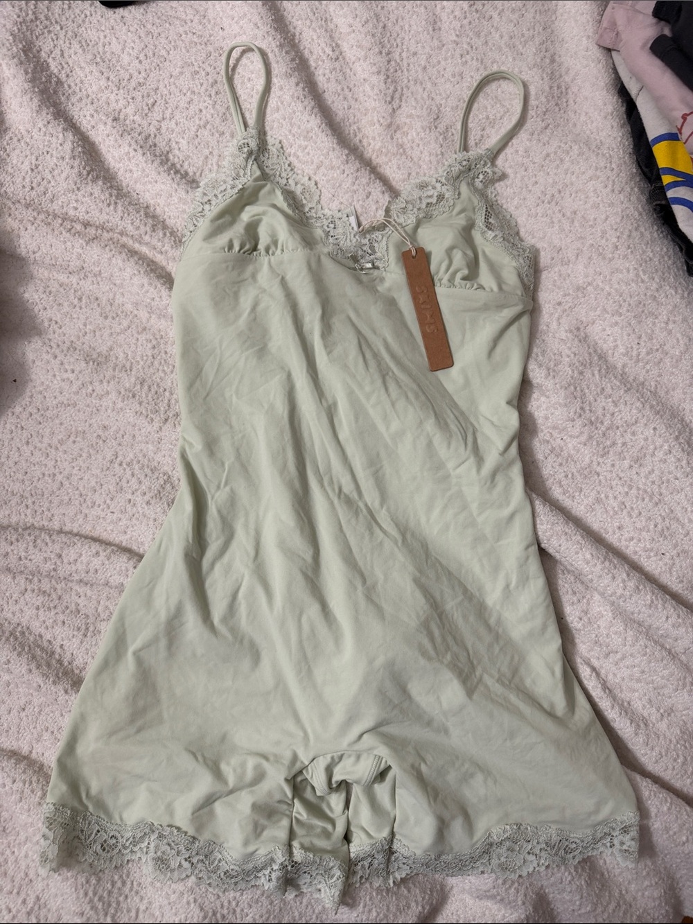 Skims  everybody lace triangle onesie medium